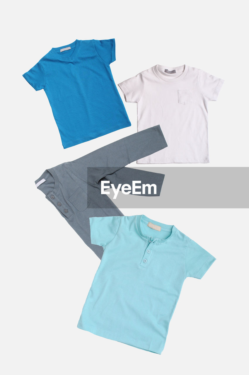 Multi colored t-shirts over white background