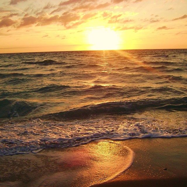 SCENIC VIEW OF SUNSET OVER SEA