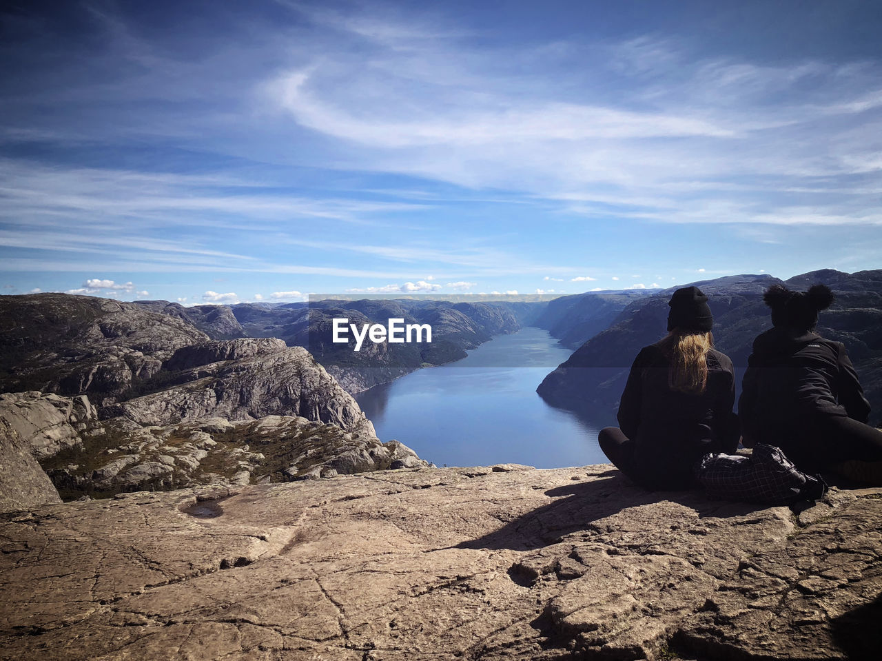 Sitting at the edge of eternity... Norway🇳🇴 Preikestolen Leisure Activity Looking At View Mountain Mountain Range Non-urban Scene Outdoors Rear View Rock - Object Scenics - Nature Sitting A New Beginning A New Beginning My Best Photo Stay Out The Great Outdoors - 2019 EyeEm Awards Stay Positive! Awards 2021: The Great Outdoors