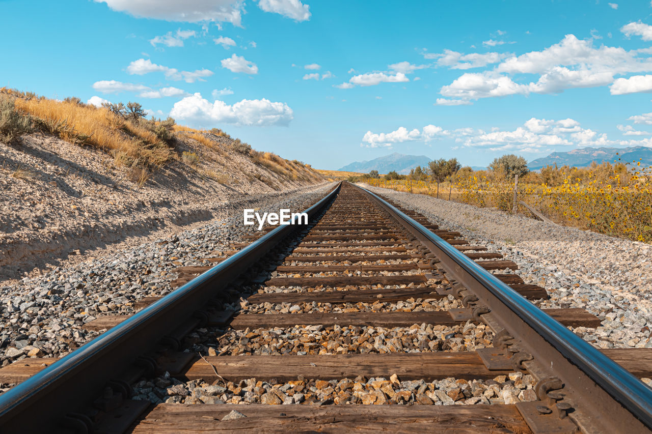 View of railroad tracks against sky in utah