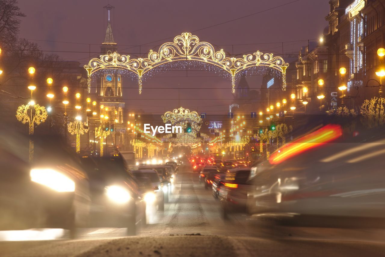 TRAFFIC ON CITY STREET AT NIGHT
