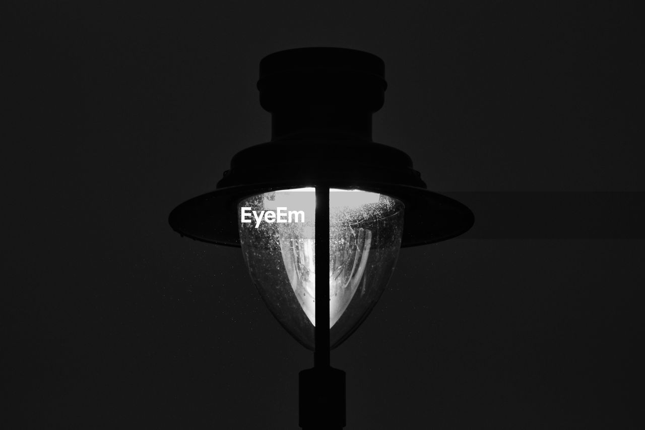 CLOSE-UP OF ILLUMINATED ELECTRIC LIGHT