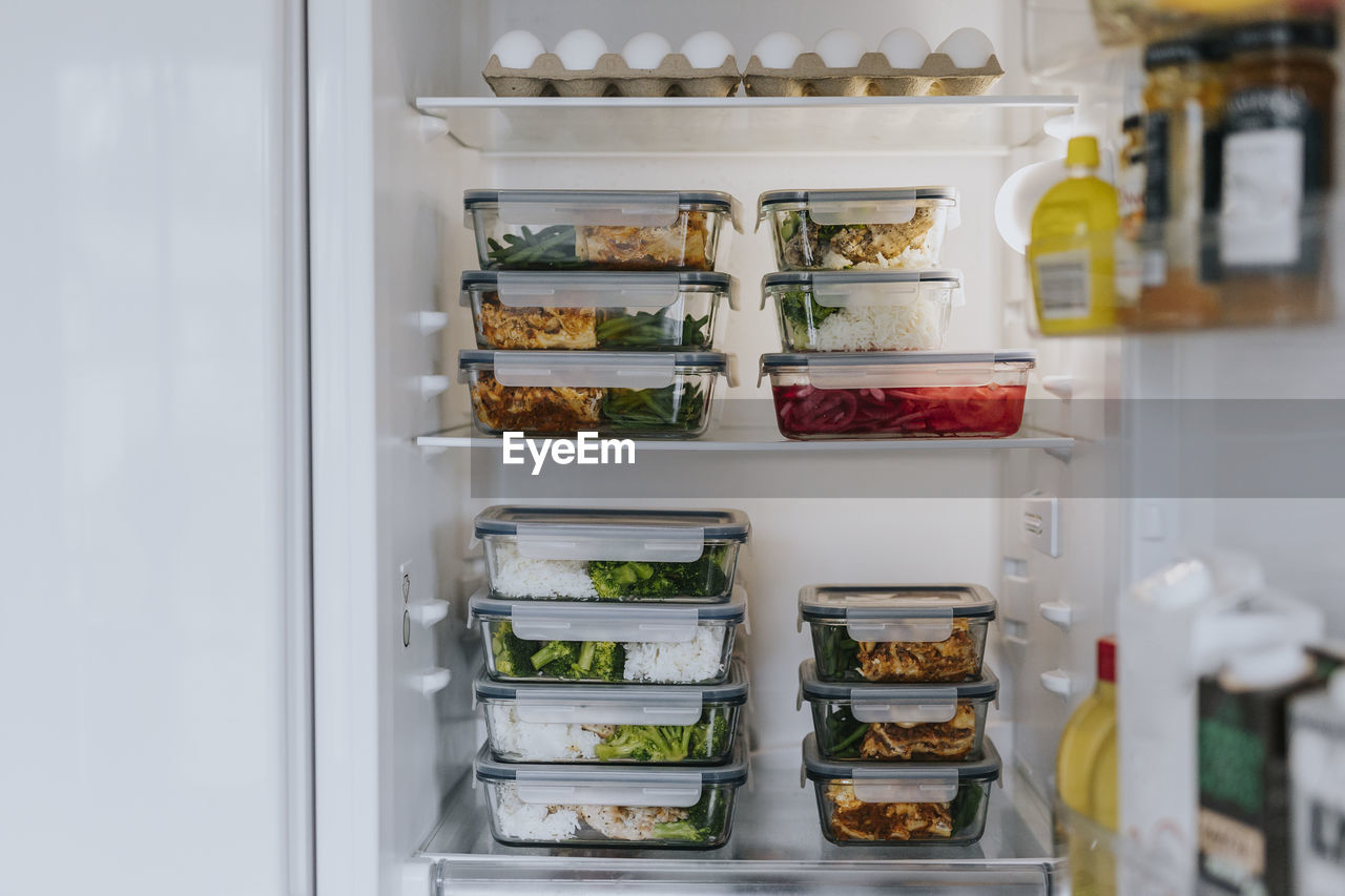 Fridge filled with lunch boxes as part of healthy meal prep