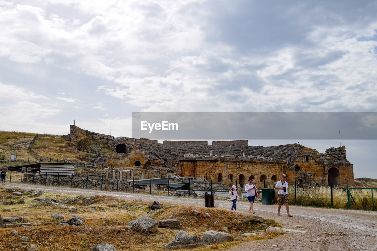 PEOPLE AT HISTORICAL BUILDING