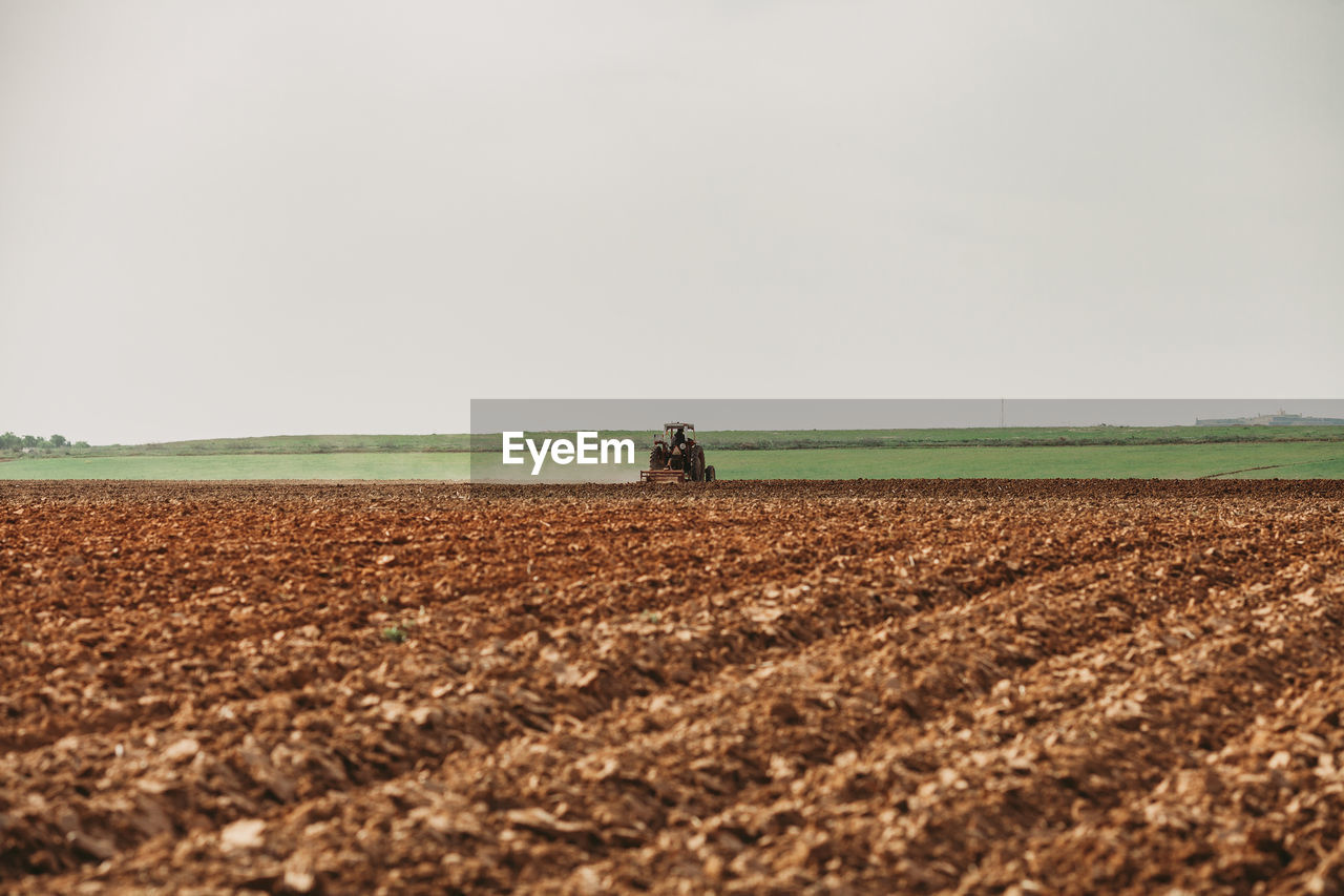 SCENIC VIEW OF FARM AGAINST CLEAR SKY