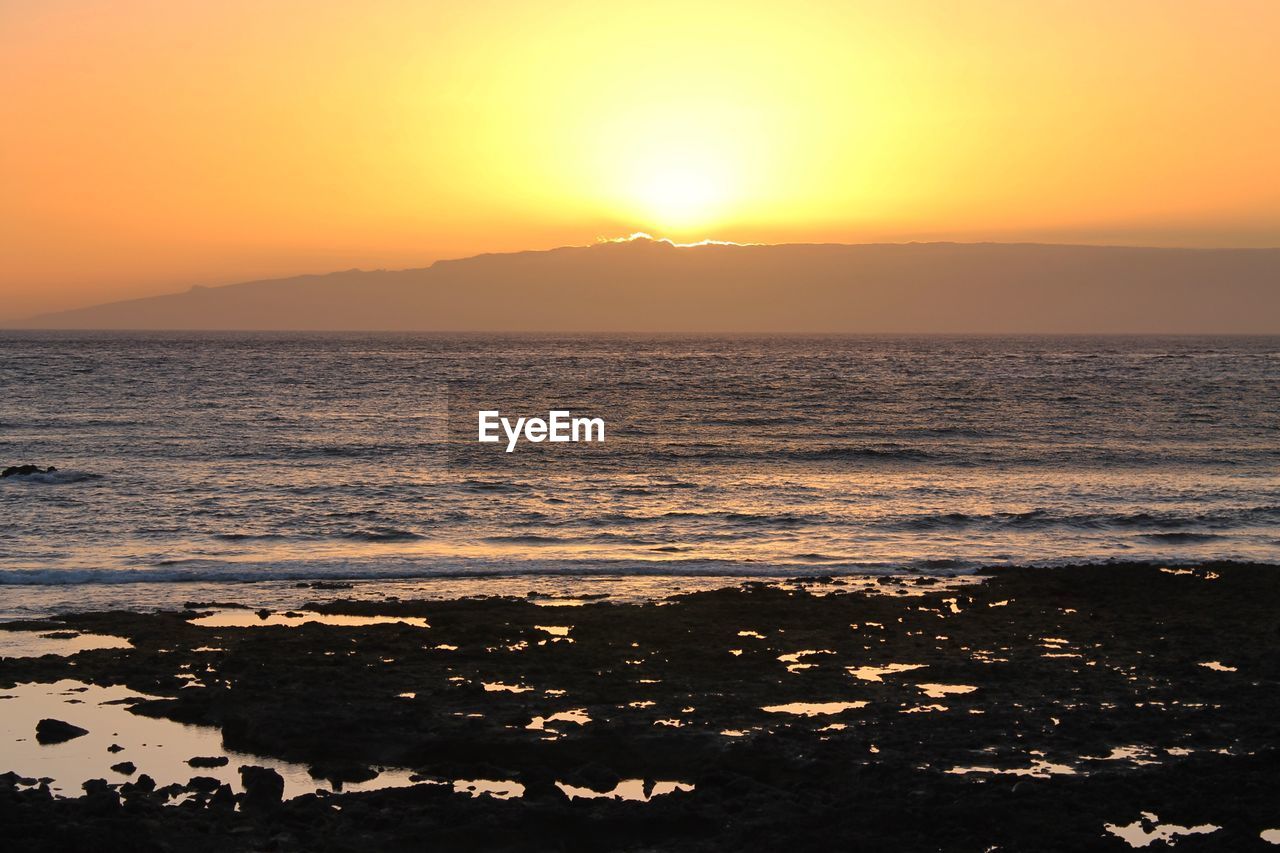 Scenic view of sea against sky during sunset