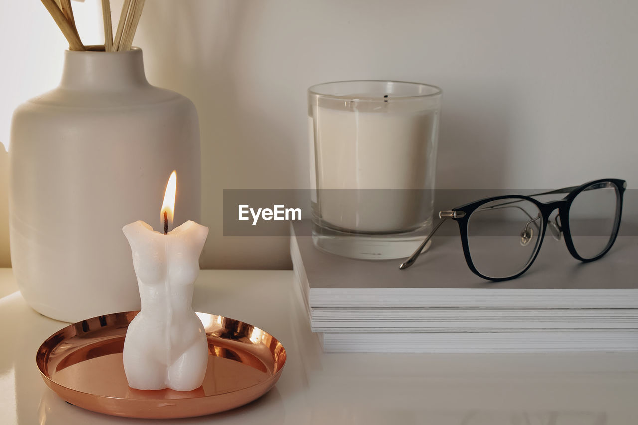 Modern trendy interior details close-up. burning candle, home decor