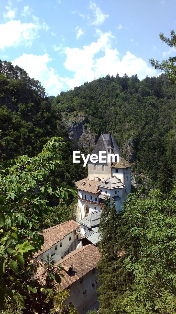 High angle view of trees and buildings against sky