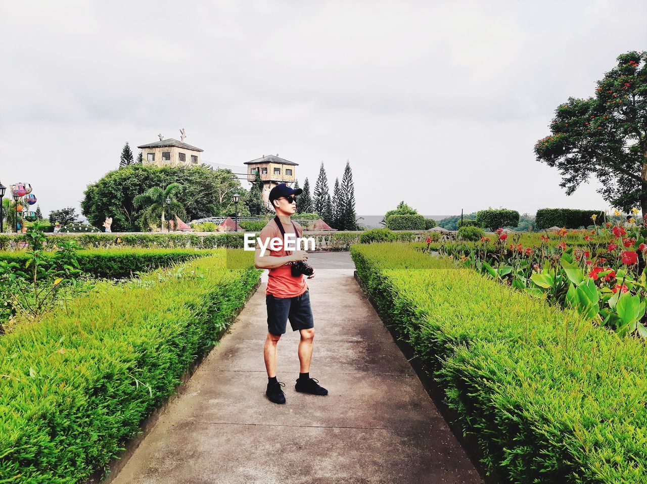 Full length of boy standing on grass against sky