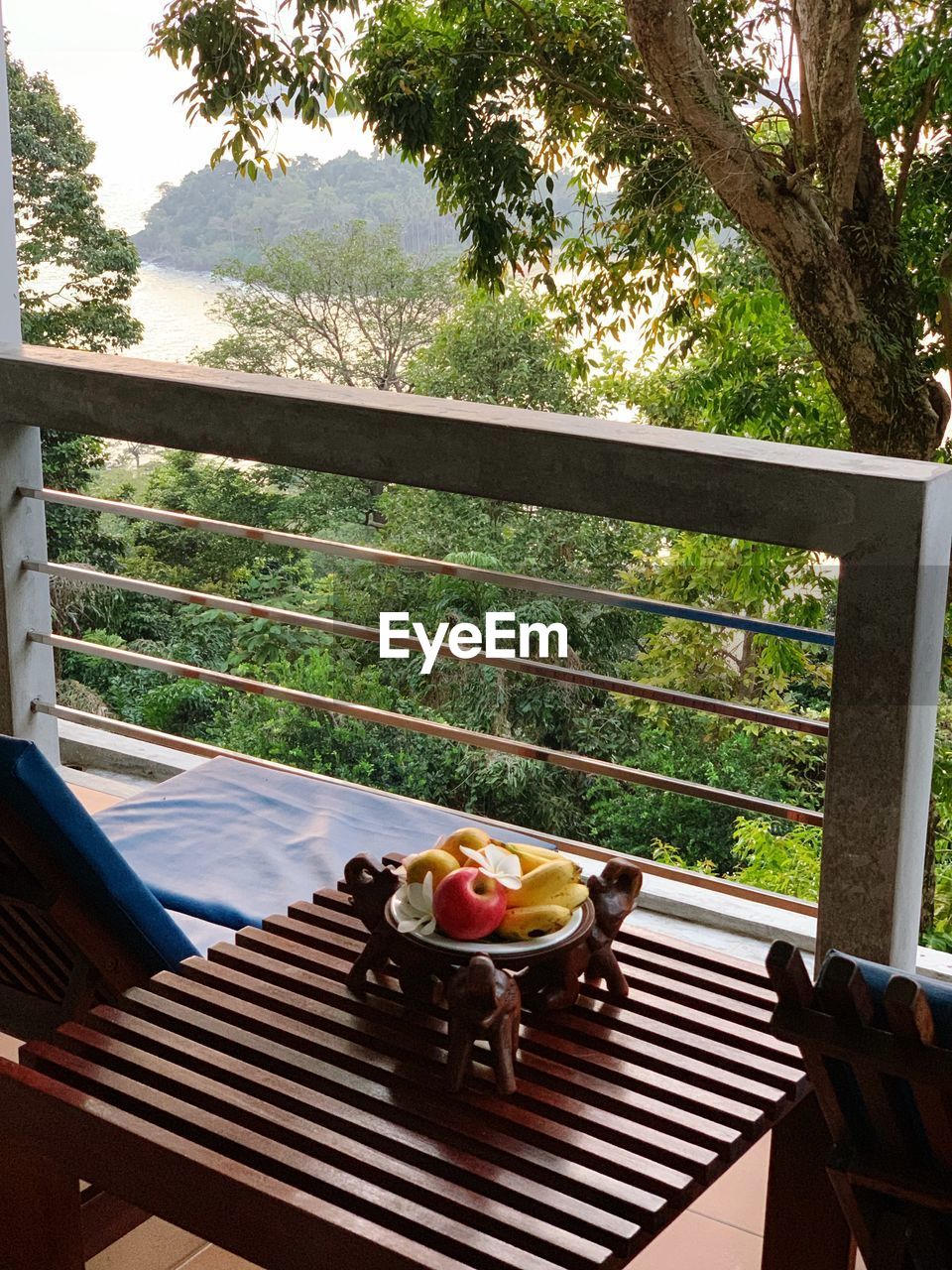 HIGH ANGLE VIEW OF FOOD ON TABLE BY RAILING