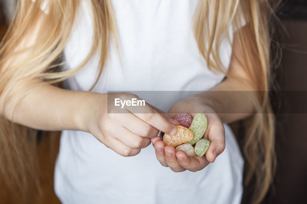 Midsection of woman holding ice cream