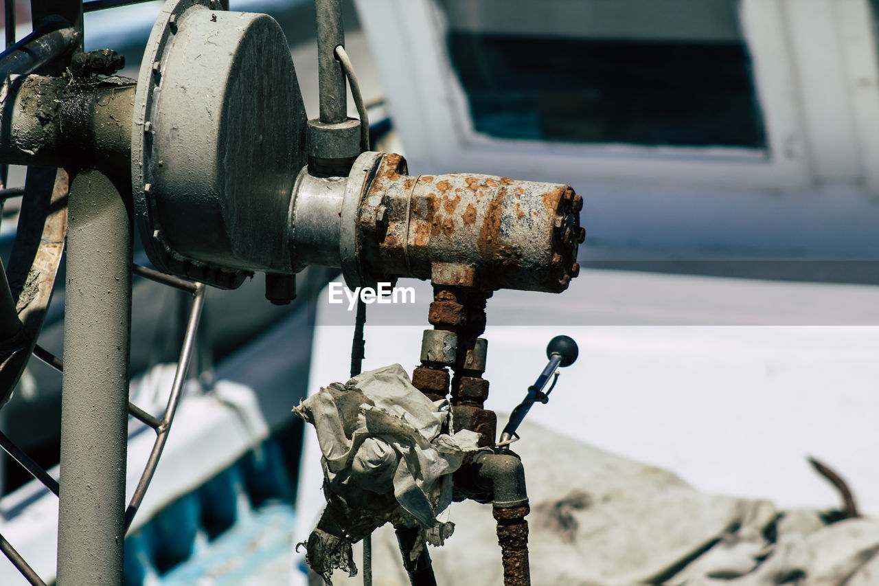 CLOSE-UP OF RUSTY MACHINE