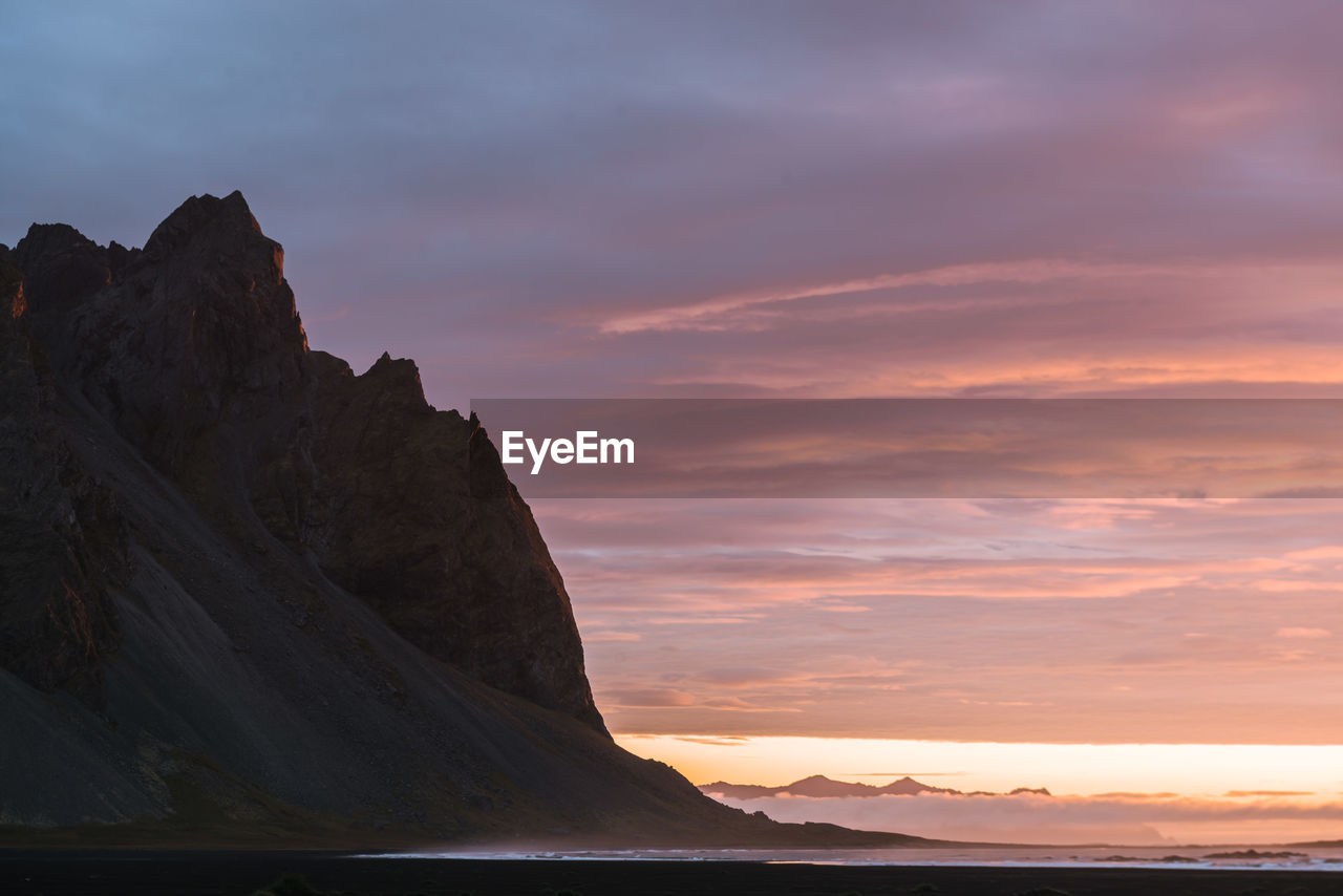 Scenic view of mountains at sunset