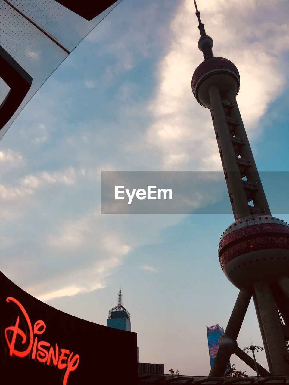 LOW ANGLE VIEW OF COMMUNICATIONS TOWER IN CITY