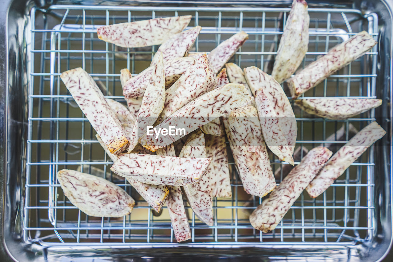 High angle view of fried taro on the grill