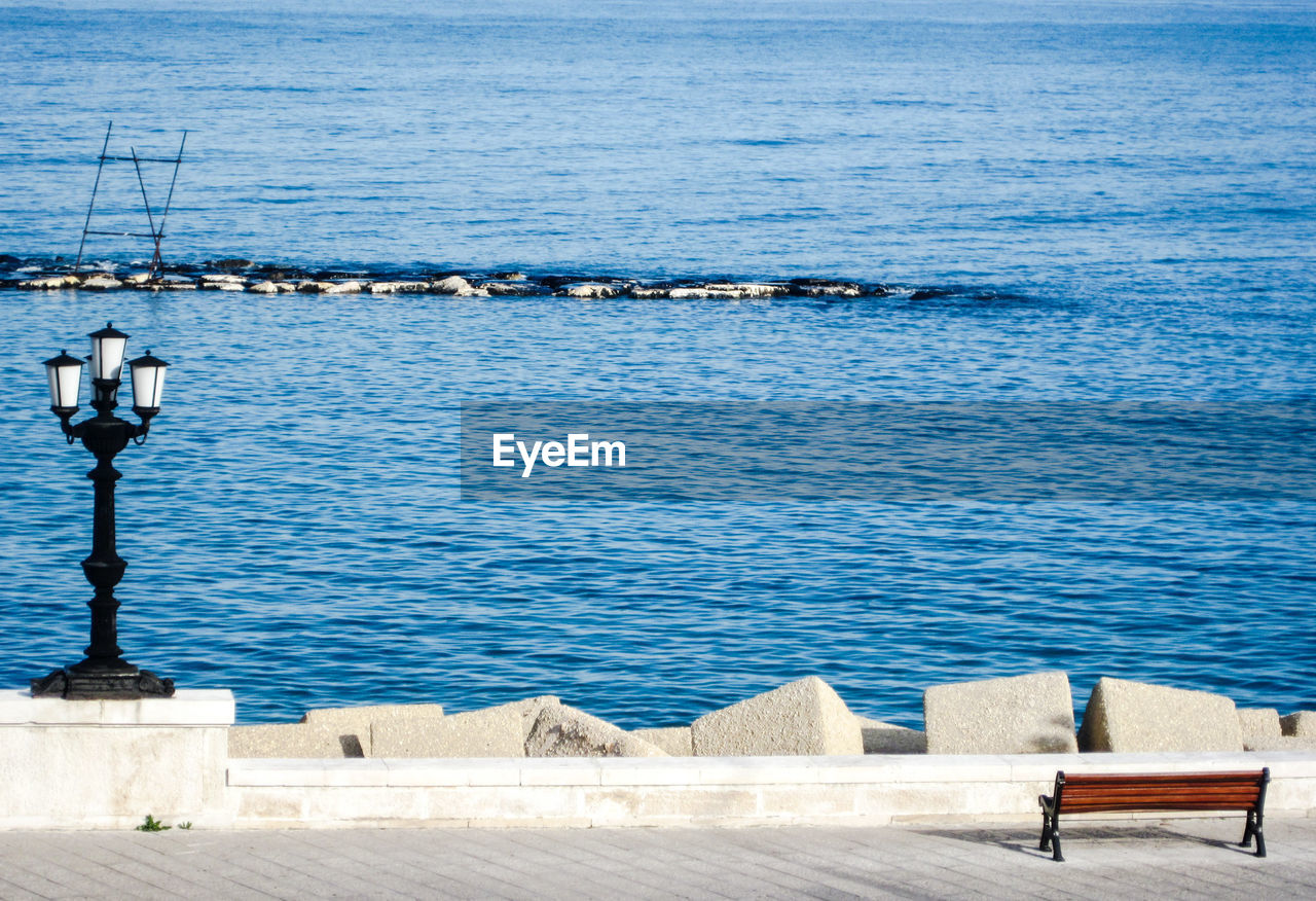 Scenic view of sea against blue sky