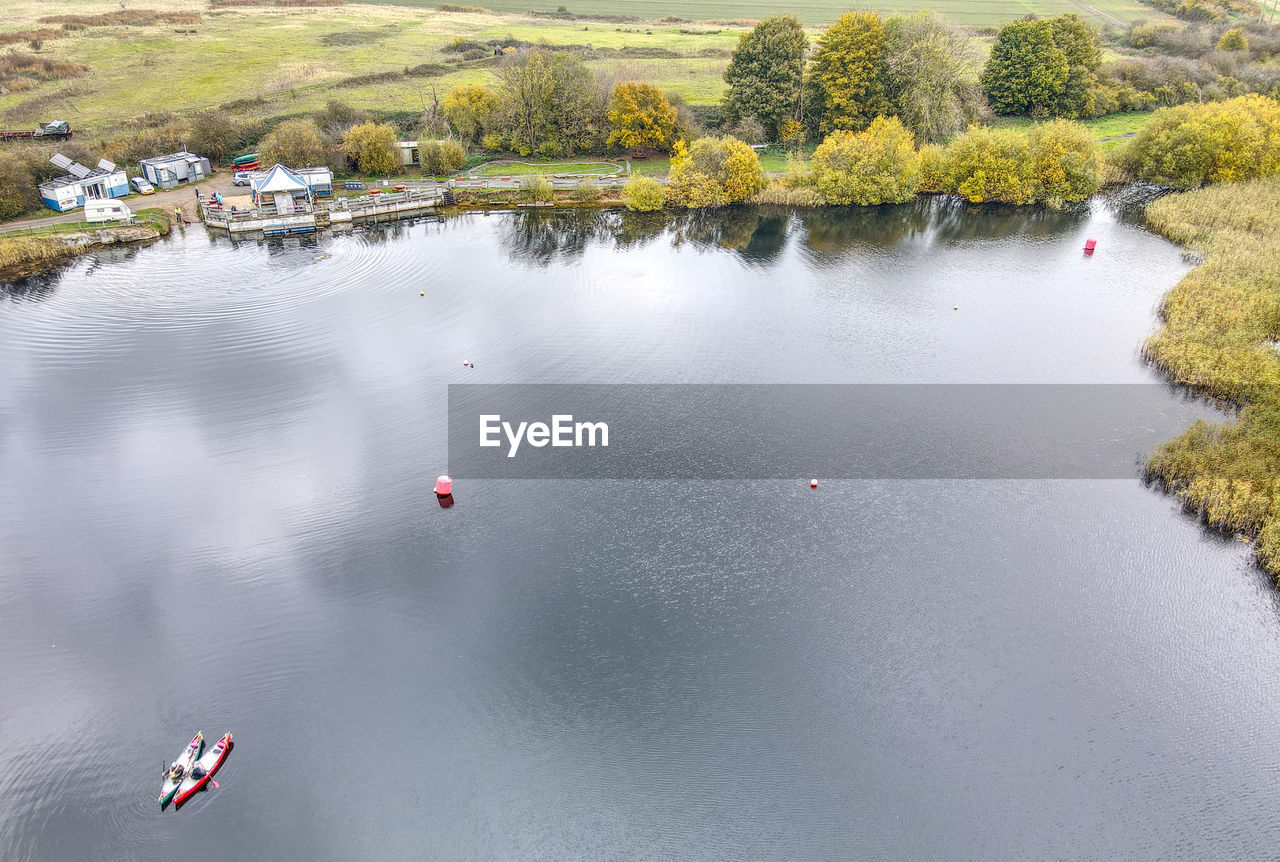 HIGH ANGLE VIEW OF LAKE BY TREES