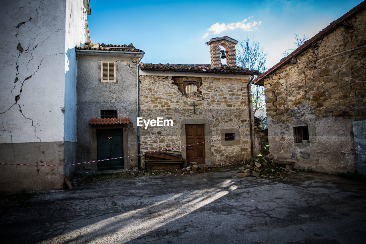 OLD HOUSE AGAINST BUILDING