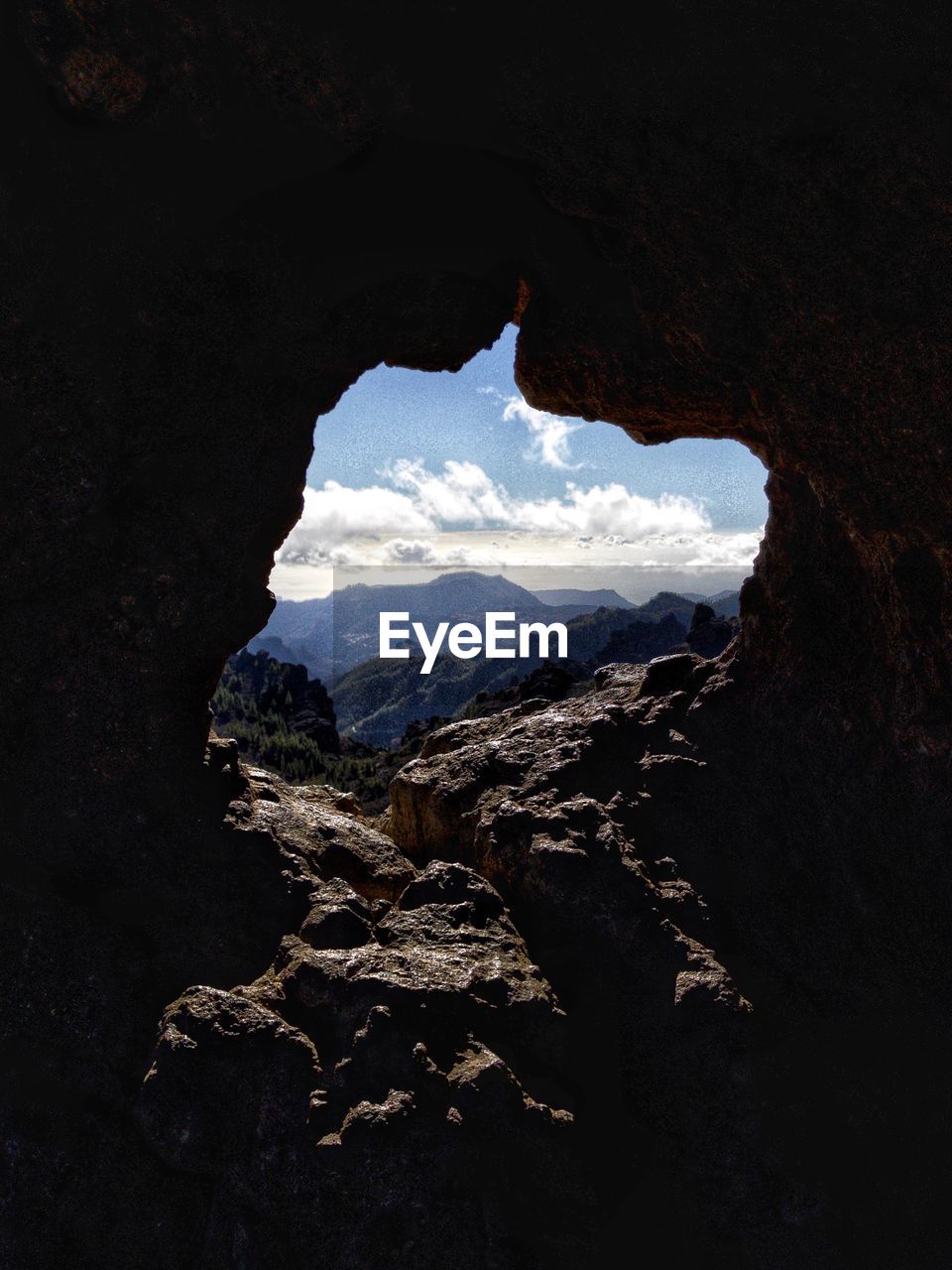 Window view through rock formation 