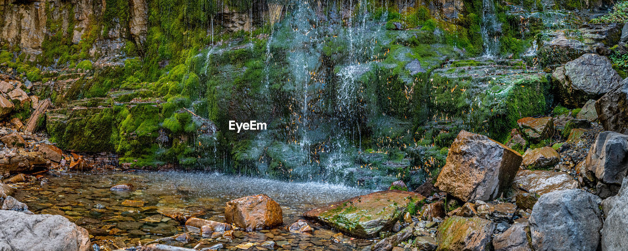 SCENIC VIEW OF WATERFALL