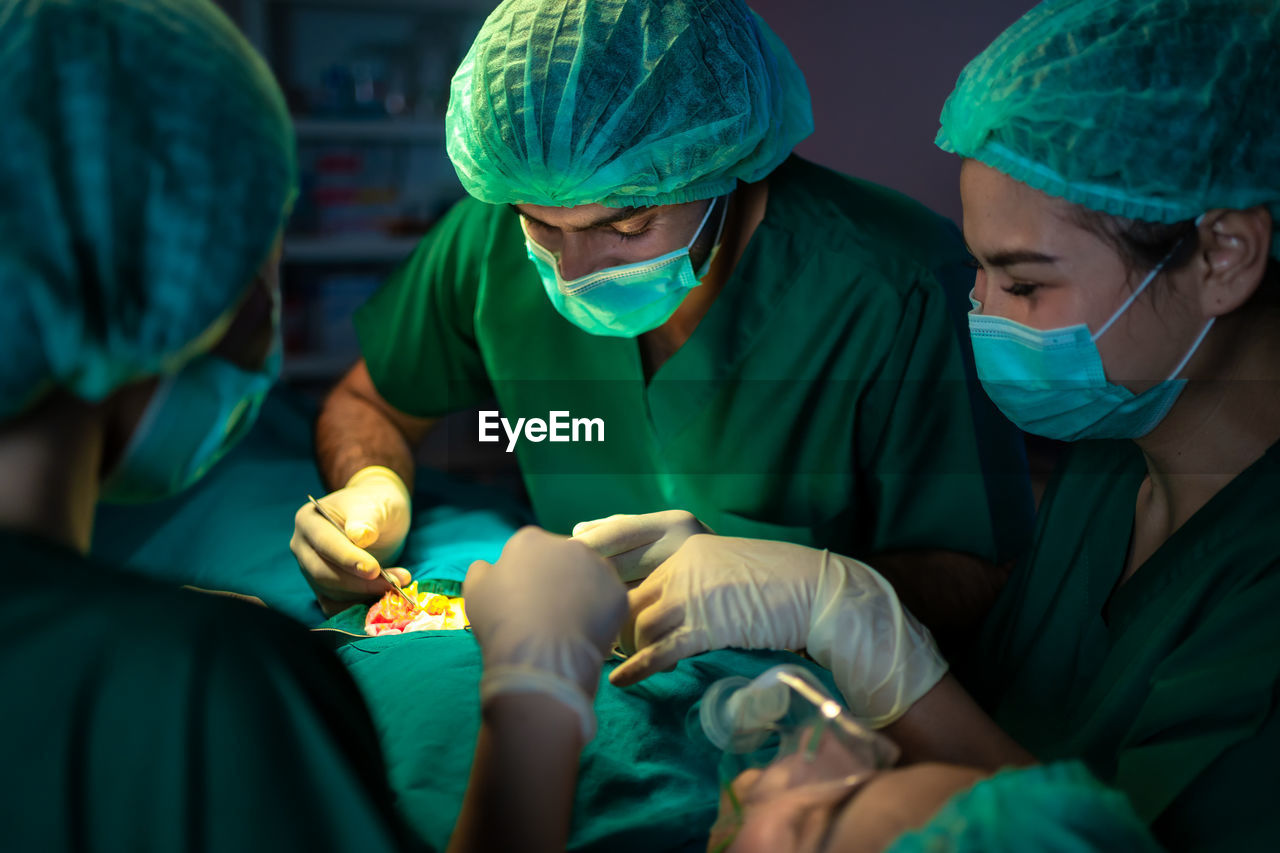 Doctors are using tools to perform patient procedures in the operating room. medical concept. 