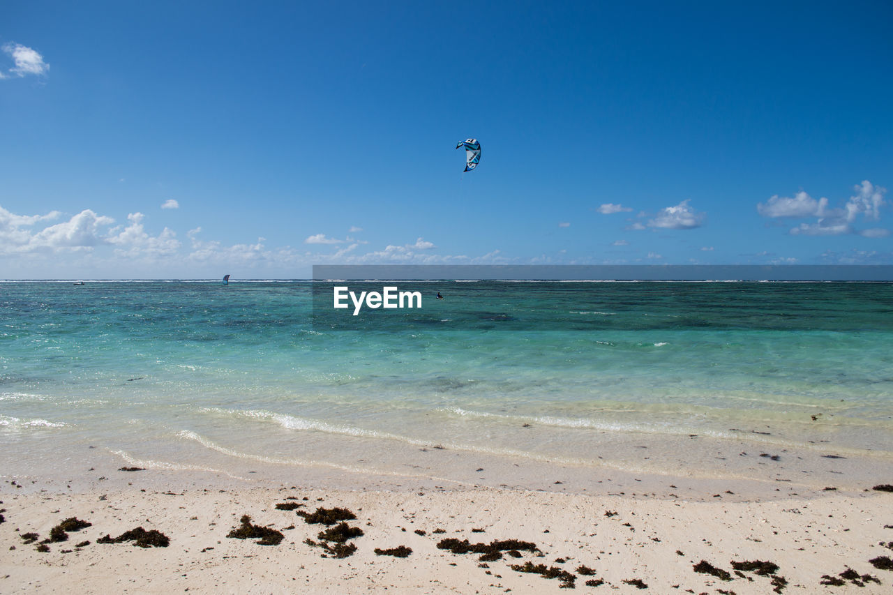 Scenic view of sea against blue sky