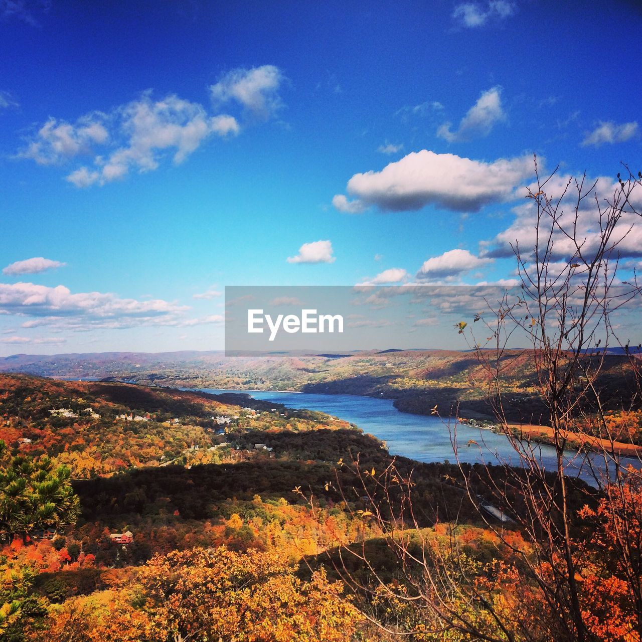 Lake along countryside landscape