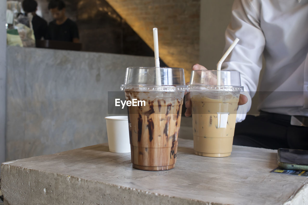 CLOSE-UP OF COFFEE ON TABLE AT HOME