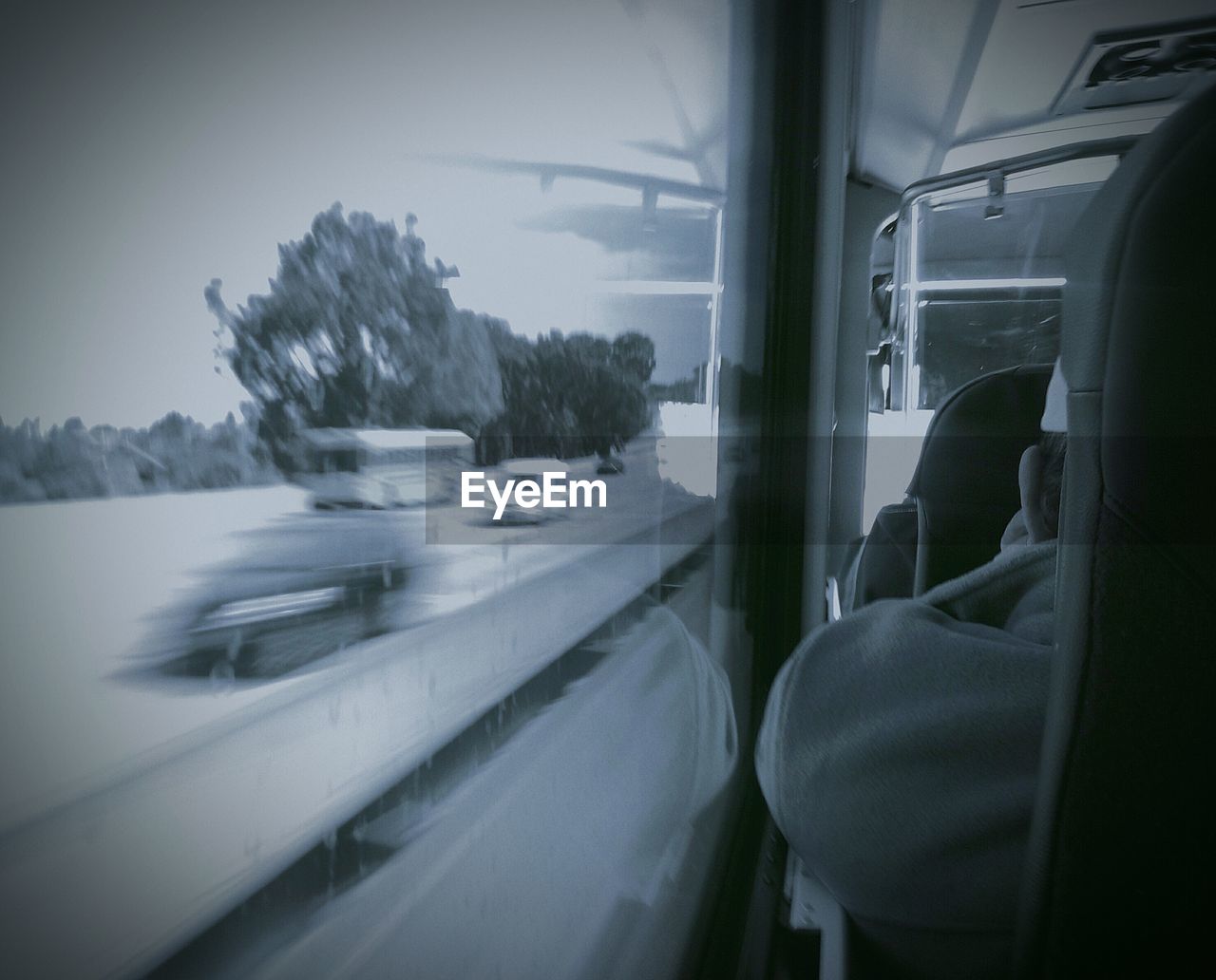 Rear view of man traveling in bus