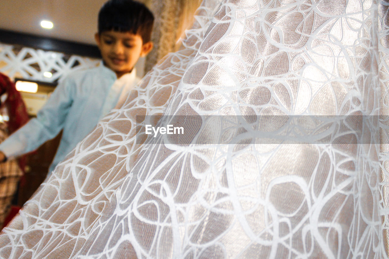 HIGH ANGLE VIEW OF WOMAN WEARING MASK