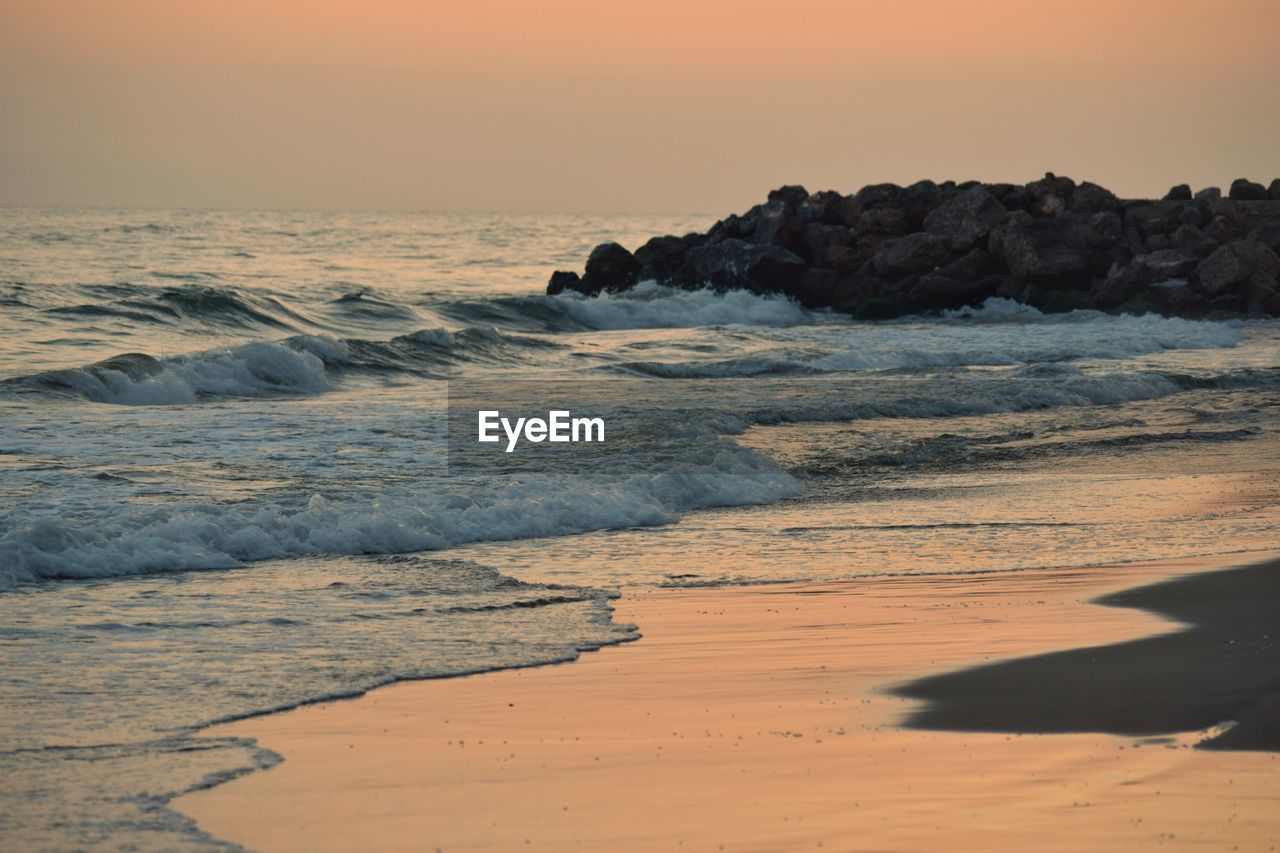 SCENIC VIEW OF SEA DURING SUNSET