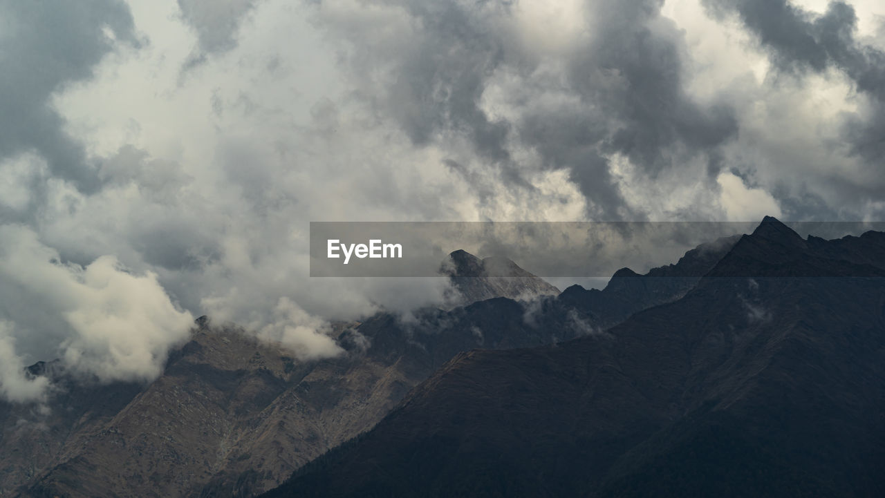 Panorama of mountain peaks in thick clouds. sochi, krasnaya polyana