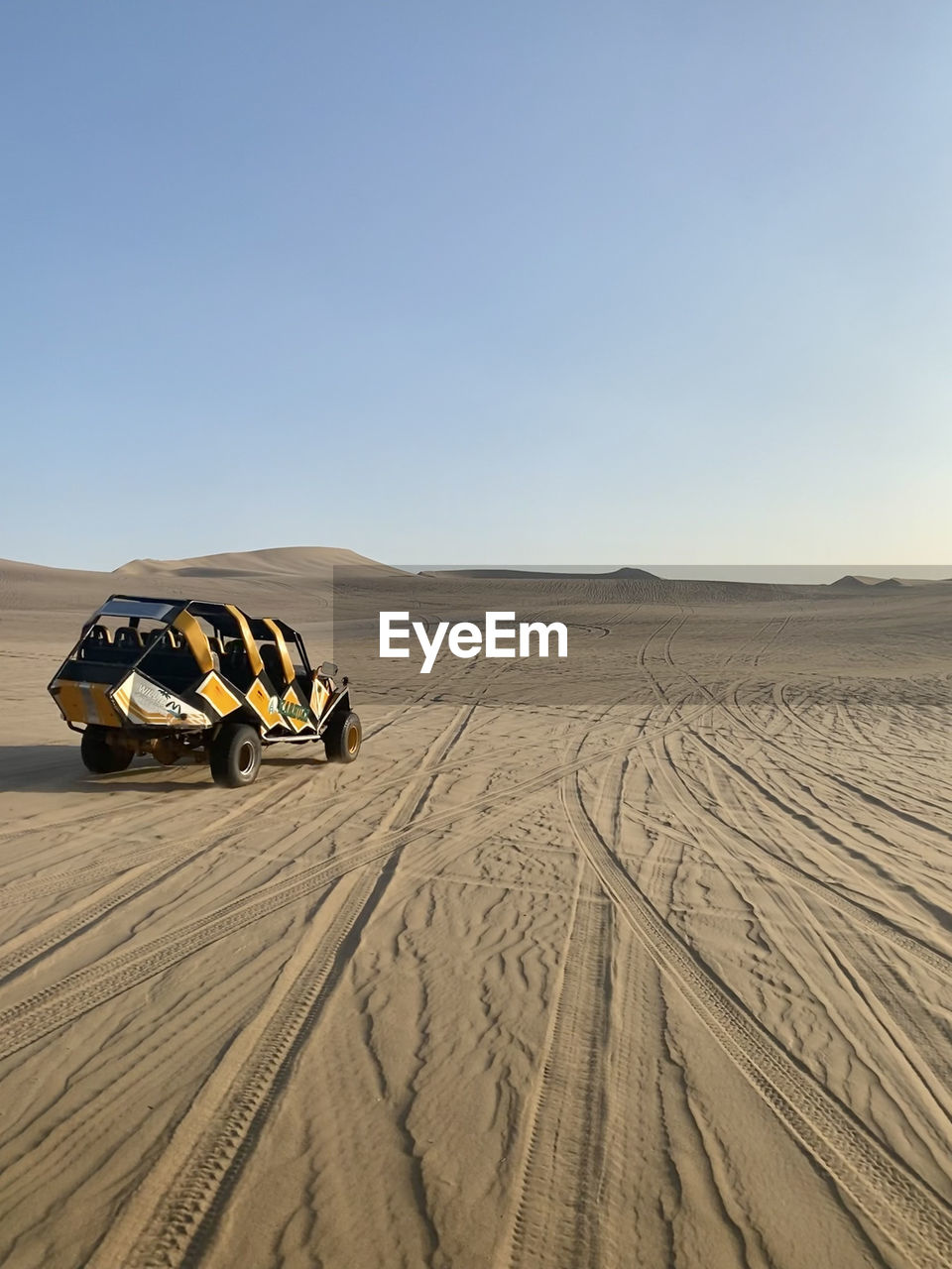 Scenic view of desert against clear sky