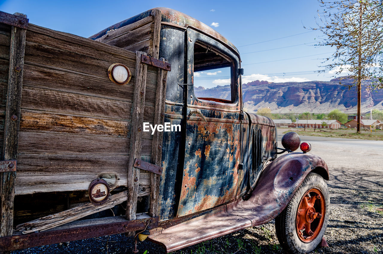 ABANDONED VEHICLE ON FIELD