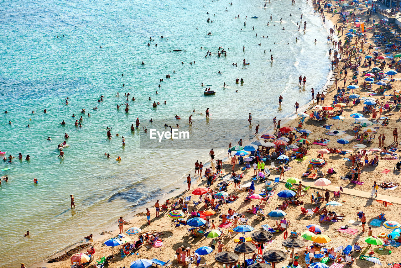 High angle view of crowd at beach in costa blanca