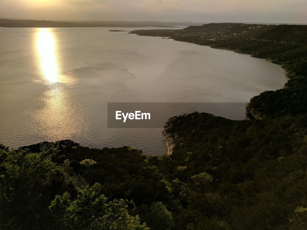 SCENIC VIEW OF BEACH AGAINST SKY DURING SUNSET