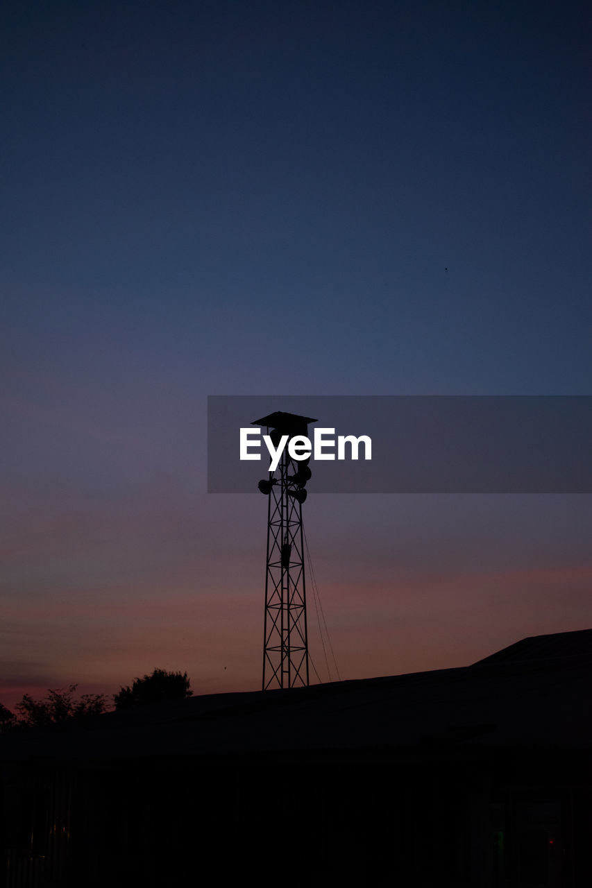 sky, silhouette, built structure, architecture, tower, sunset, dusk, technology, nature, horizon, night, no people, evening, communications tower, light, cloud, power generation, copy space, building exterior, water tower, outdoors, water tower - storage tank, scenics - nature, darkness, tranquility