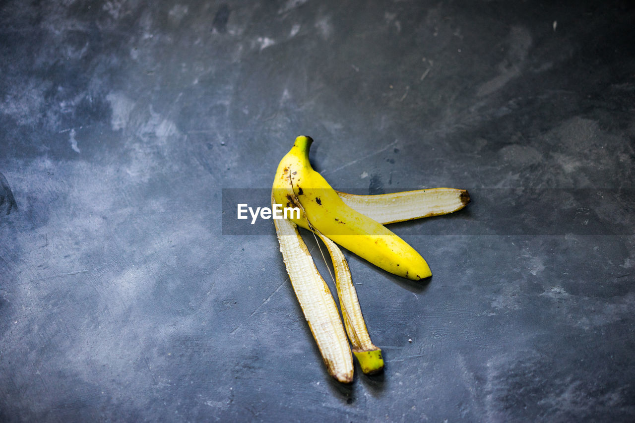 Directly above shot of banana peel on gray table