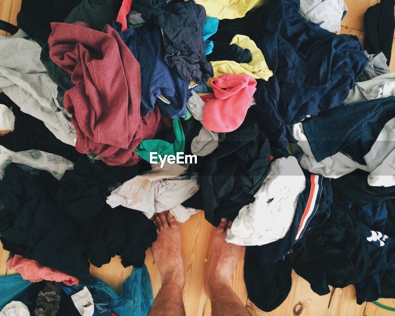 High angle view of unwashed clothes on floor