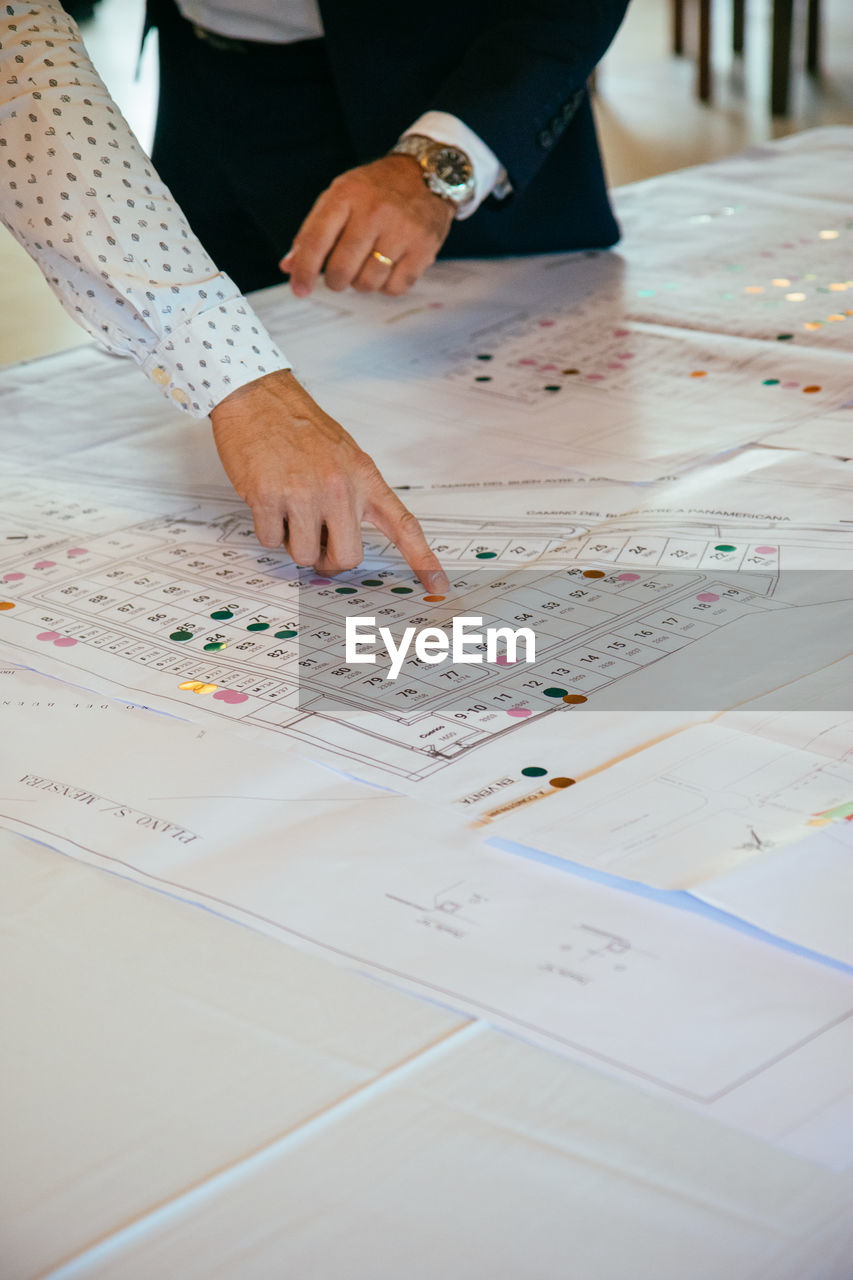 Cropped image of business people working at office