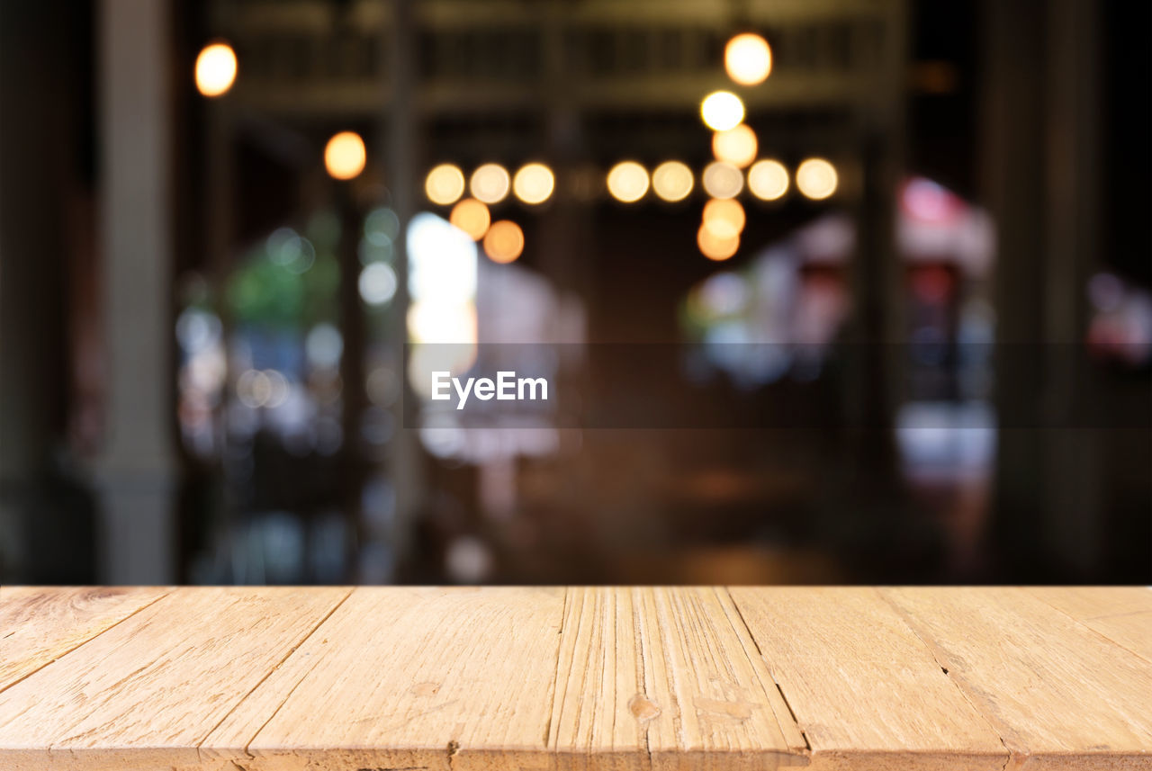 Close-up of wooden table at home