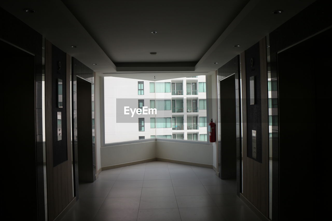 corridor, indoors, architecture, arcade, door, building, entrance, interior design, hall, flooring, window, no people, built structure, room, lighting, open, ceiling