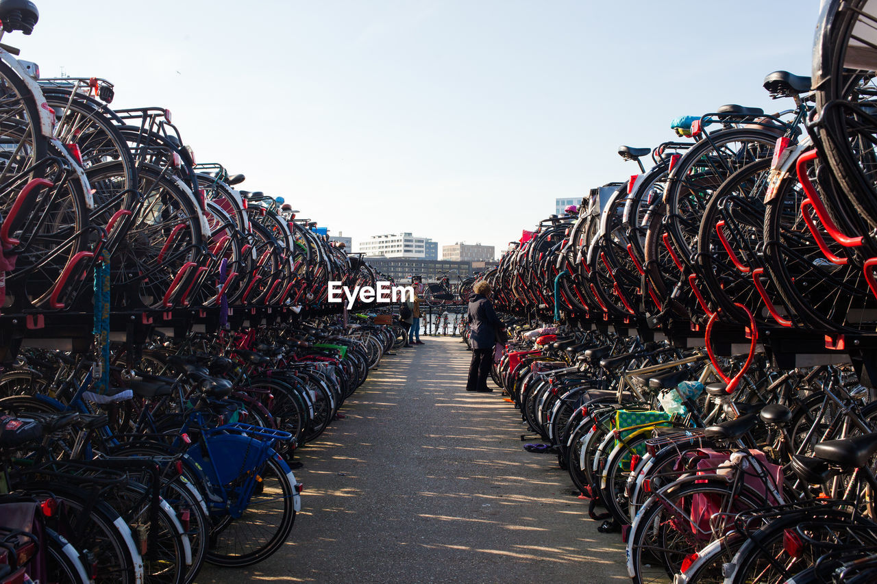 Bicycles on racks against clear sky