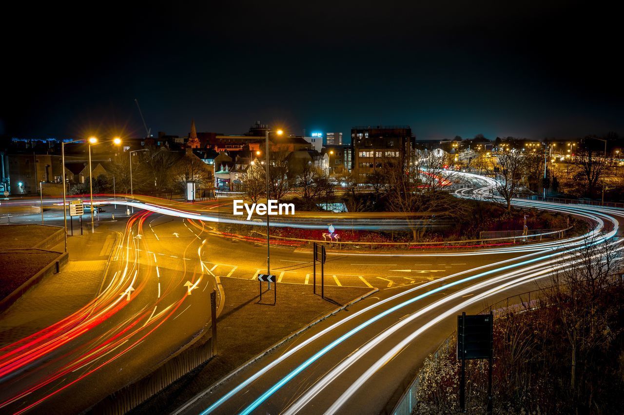 High angle view of light trails on road at night