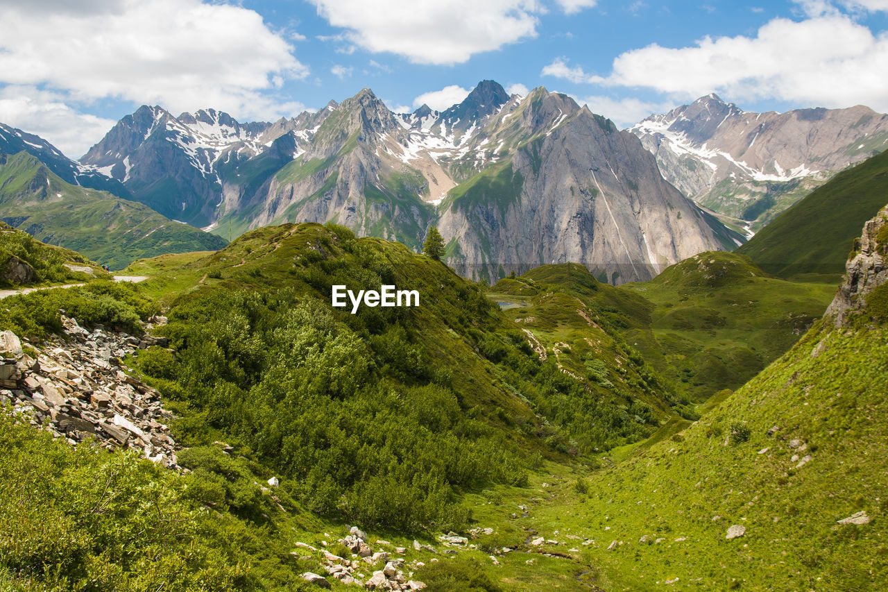 SCENIC VIEW OF VALLEY AND MOUNTAINS