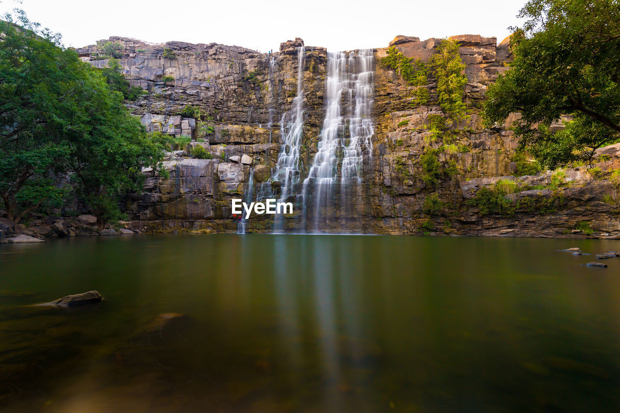 VIEW OF WATERFALL IN FOREST