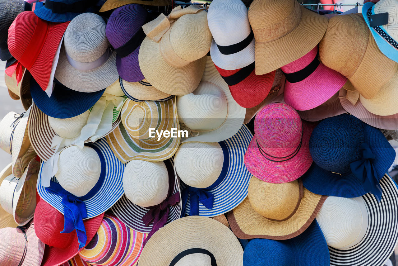 large group of objects, multi colored, retail, abundance, market, for sale, no people, variation, full frame, high angle view, backgrounds, blue, business finance and industry, store, sale, still life, day, market stall, hat, business, retail display