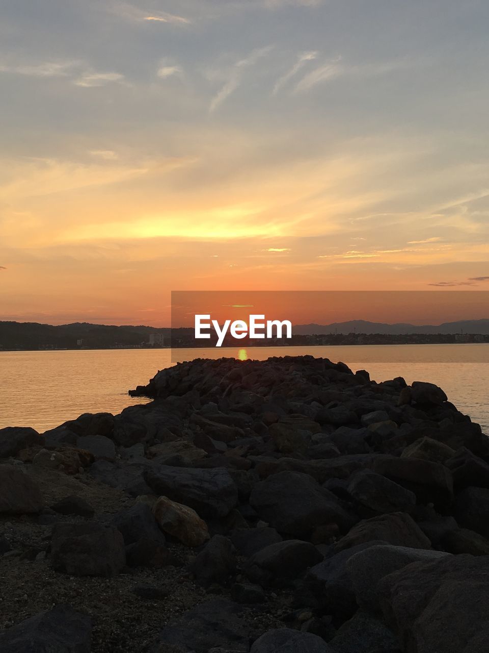 SCENIC VIEW OF SEA AGAINST ORANGE SKY