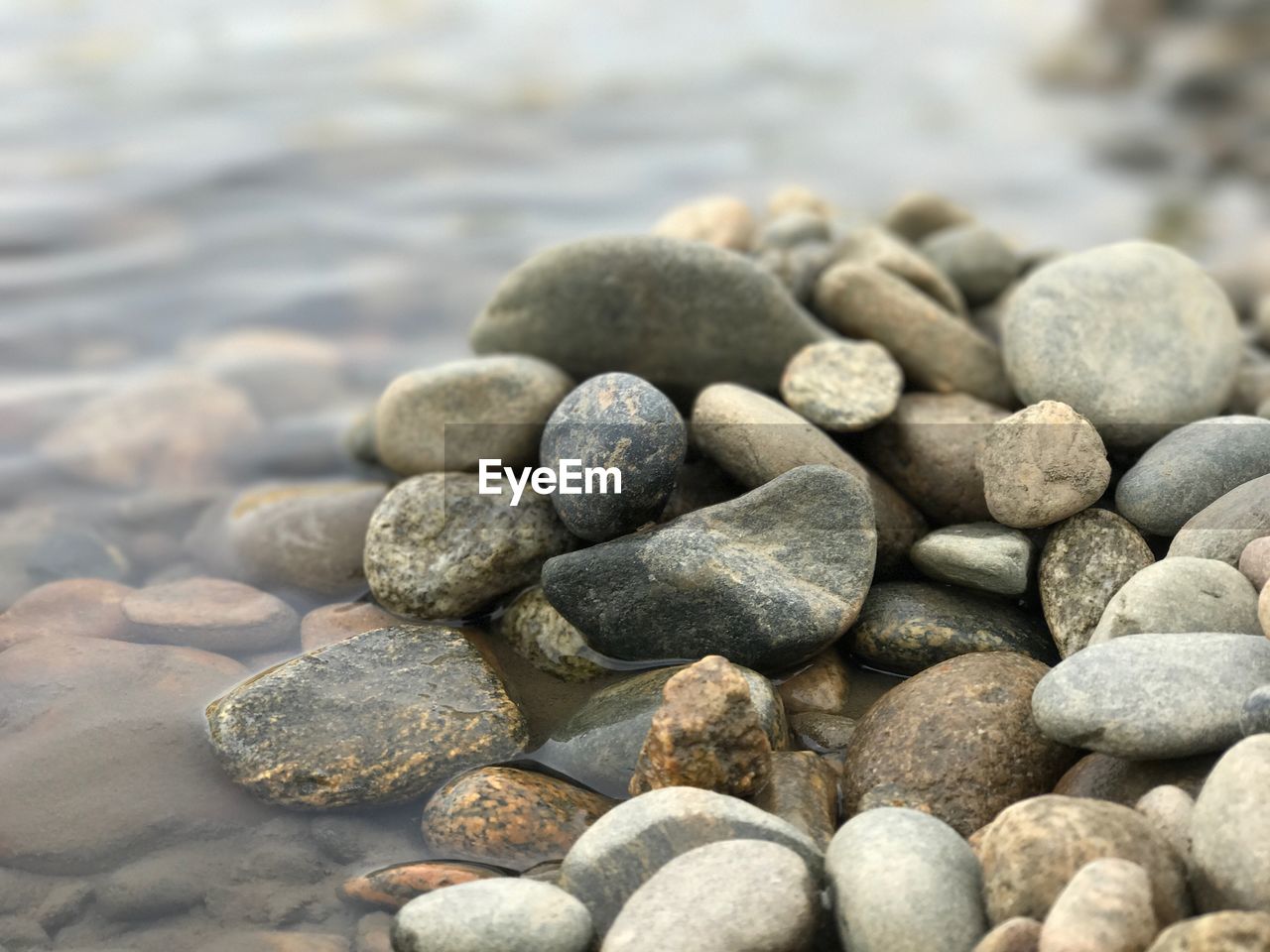 Close-up of pebble stones at beach