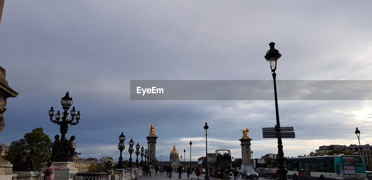 LOW ANGLE VIEW OF STREET LIGHT BY BUILDING